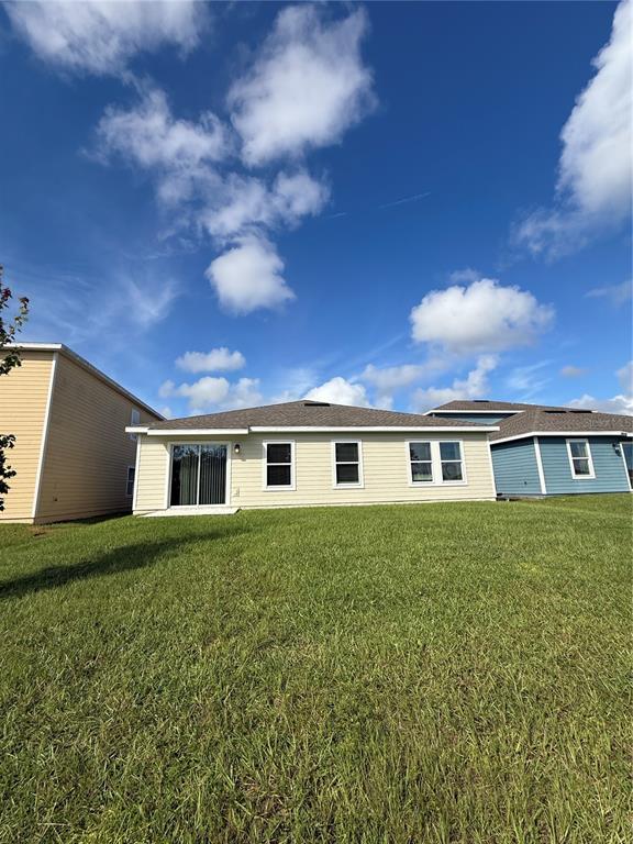 2011 Myrtle Pine Street Kissimmee, FL 34746 - Photo 27 of 28 front view of house with a yard
