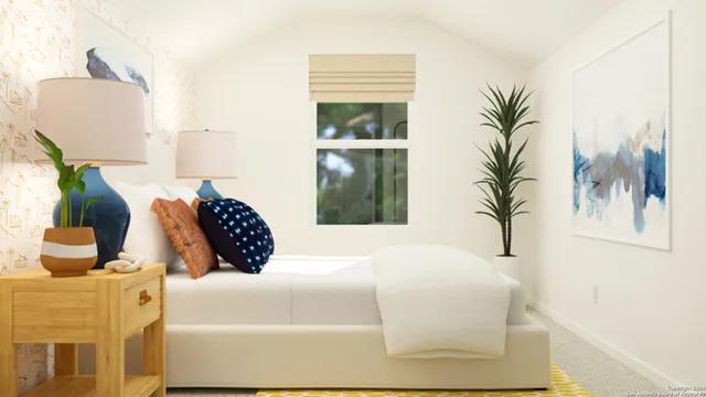 a bedroom with a large bed and a potted plant