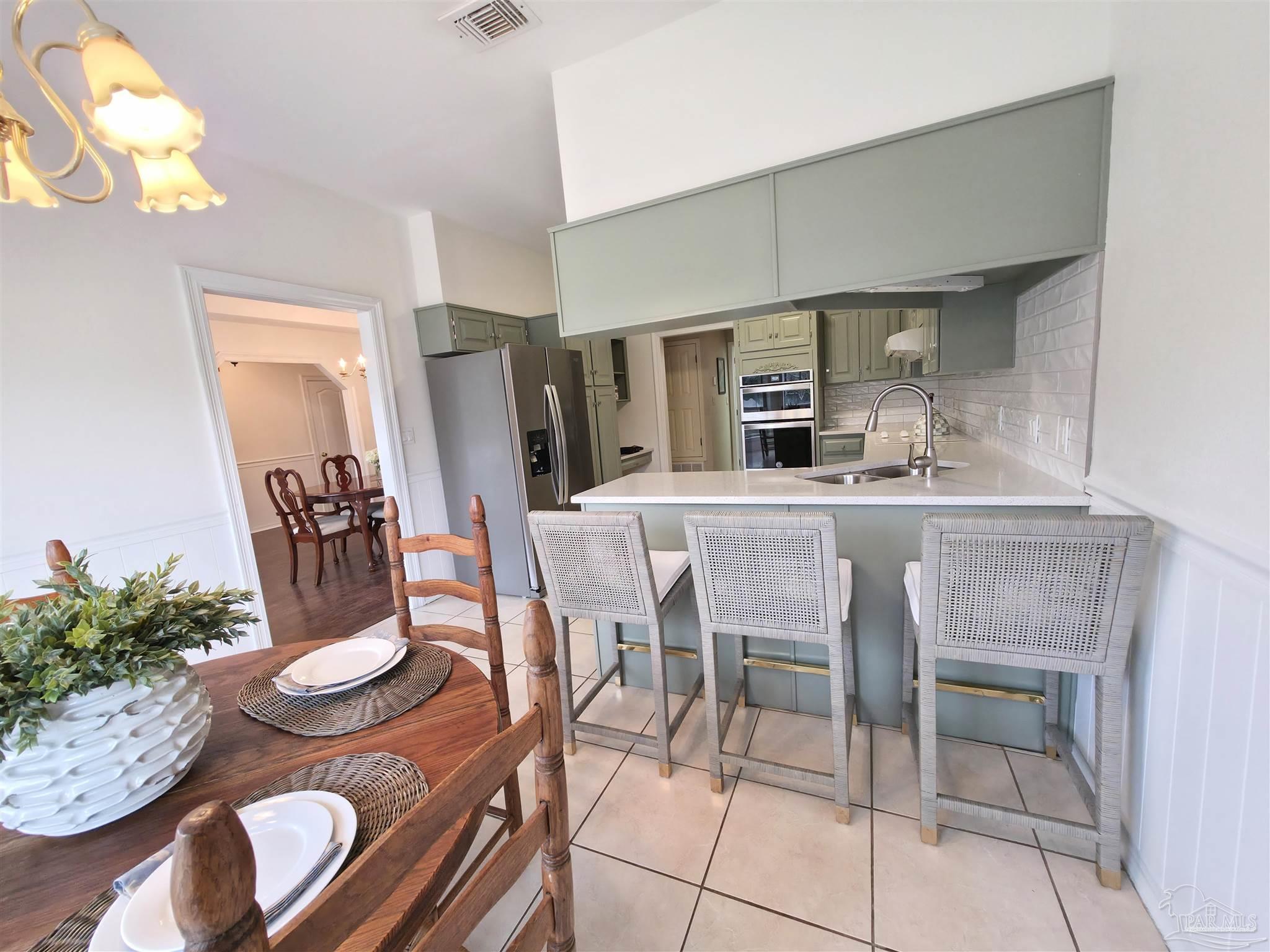 3249 Windmill Circle Cantonment, FL 32533 - Photo 15 of 44 a dining room with furniture and window