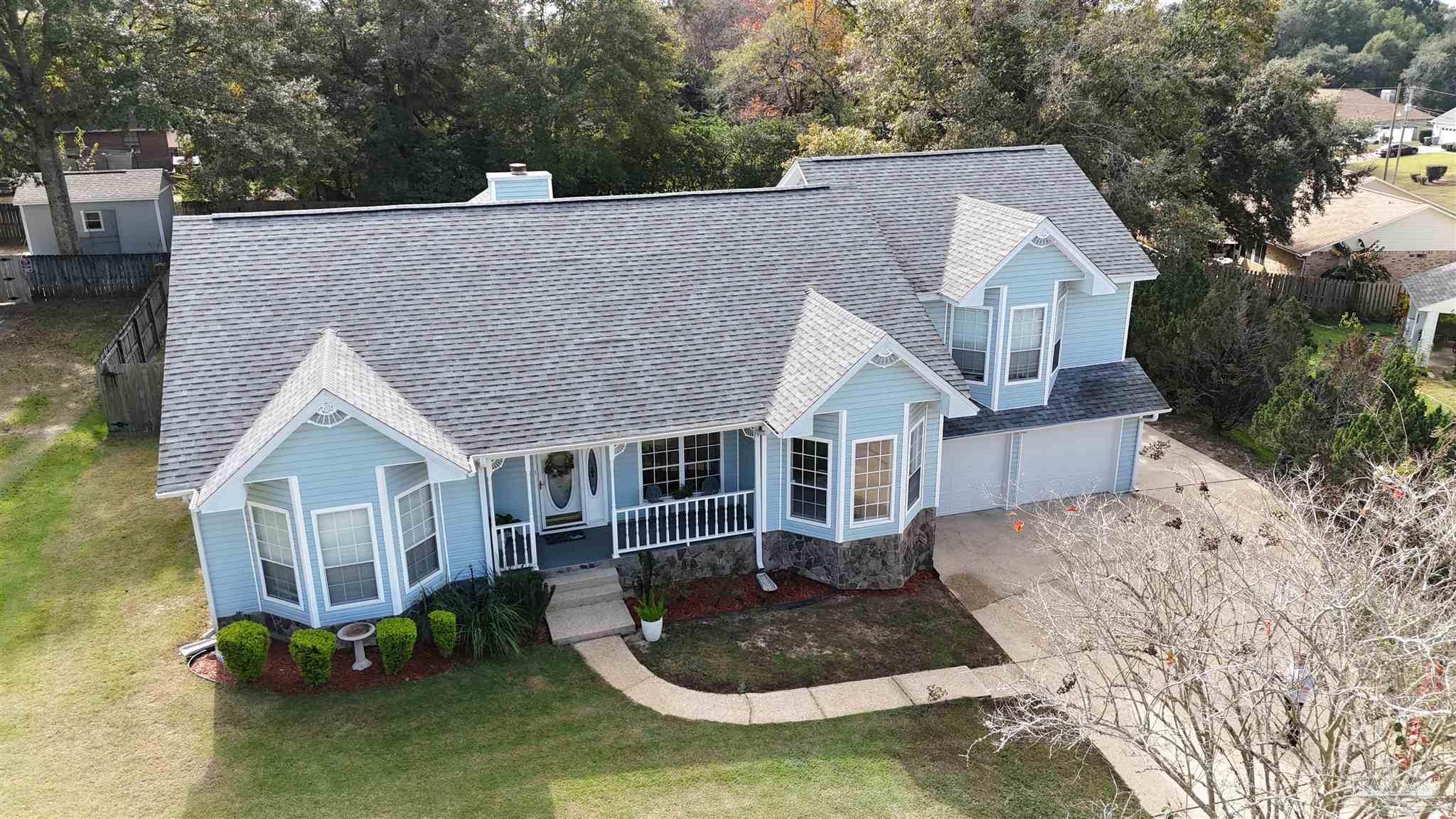 3249 Windmill Circle Cantonment, FL 32533 - Photo 2 of 44 a aerial view of a house with yard
