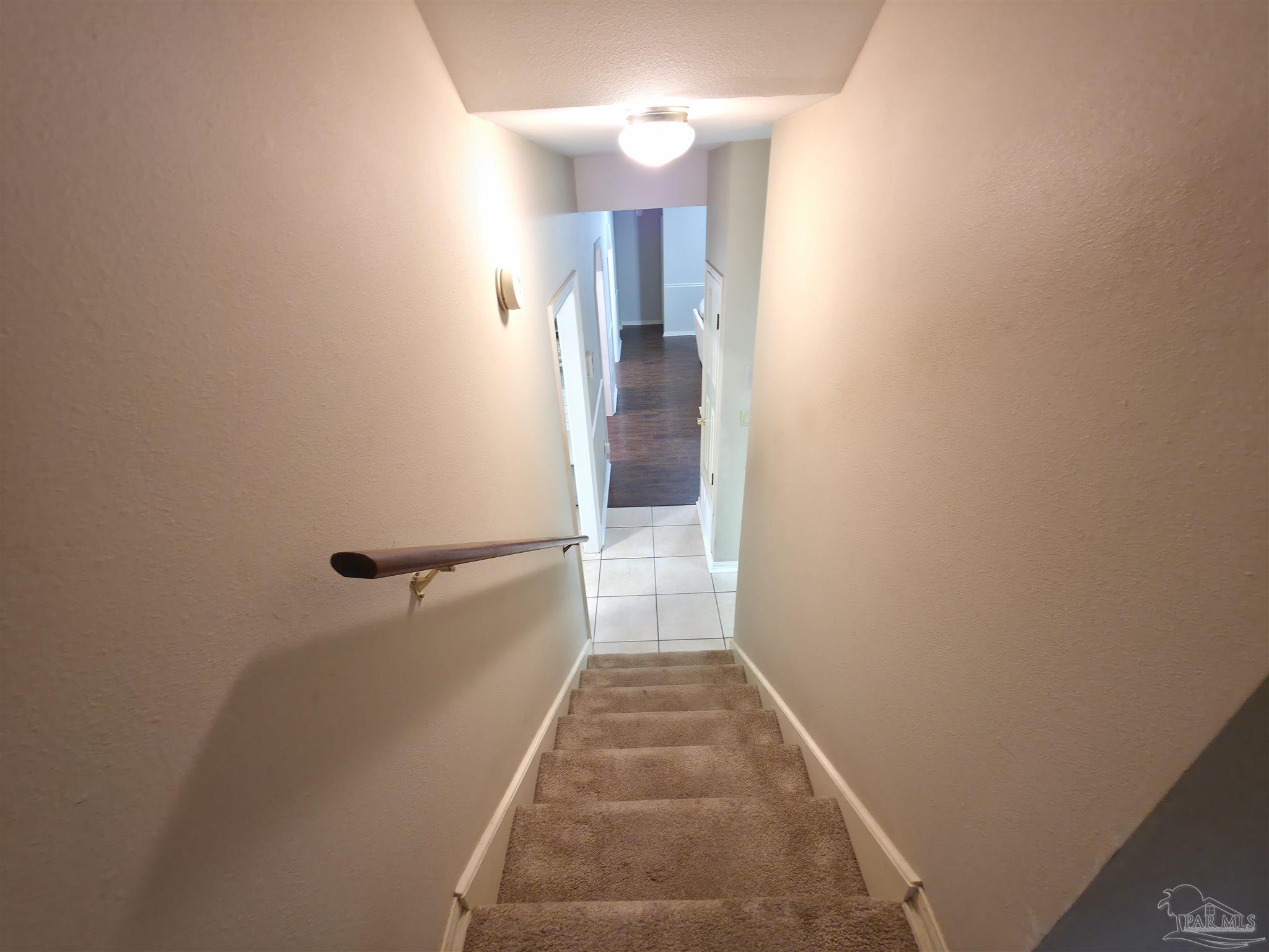 3249 Windmill Circle Cantonment, FL 32533 - Photo 28 of 44 a view of a hallway with wooden floor and a bathroom