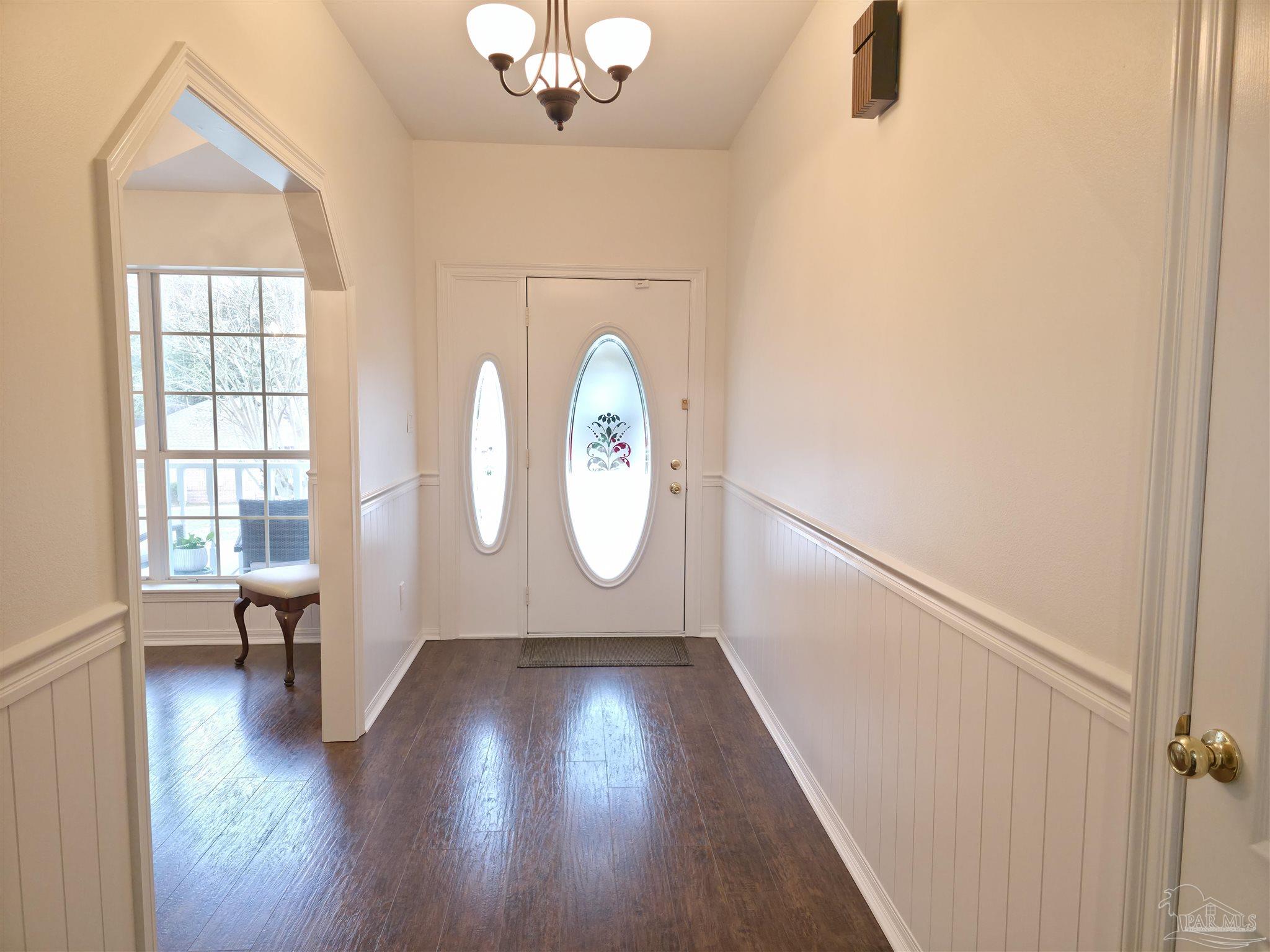3249 Windmill Circle Cantonment, FL 32533 - Photo 4 of 44 wooden floor in an empty room with a window