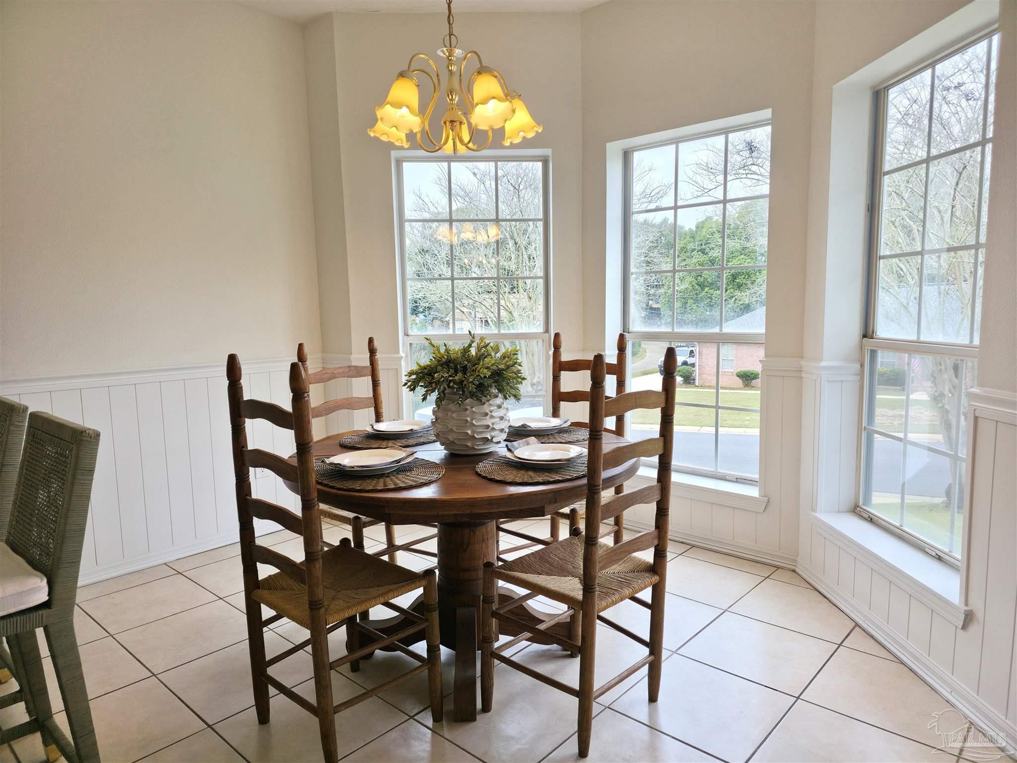 3249 Windmill Circle Cantonment, FL 32533 - Photo 8 of 44 a view of a dining room with furniture window and outside view