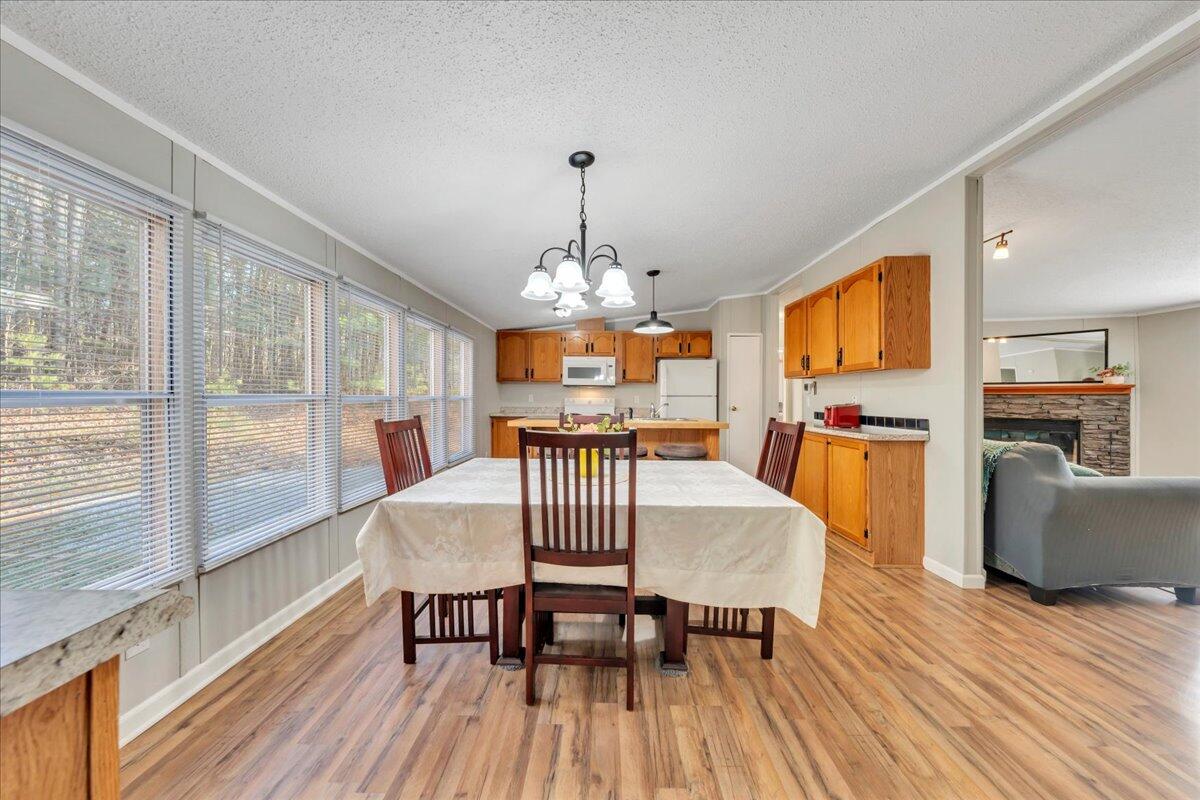 5452 Haw Patch Road Ferrum, VA 24088 - Photo 9 of 35 a view of a dining room with furniture window and wooden floor