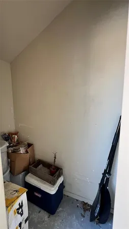 a living room with furniture and a mirror