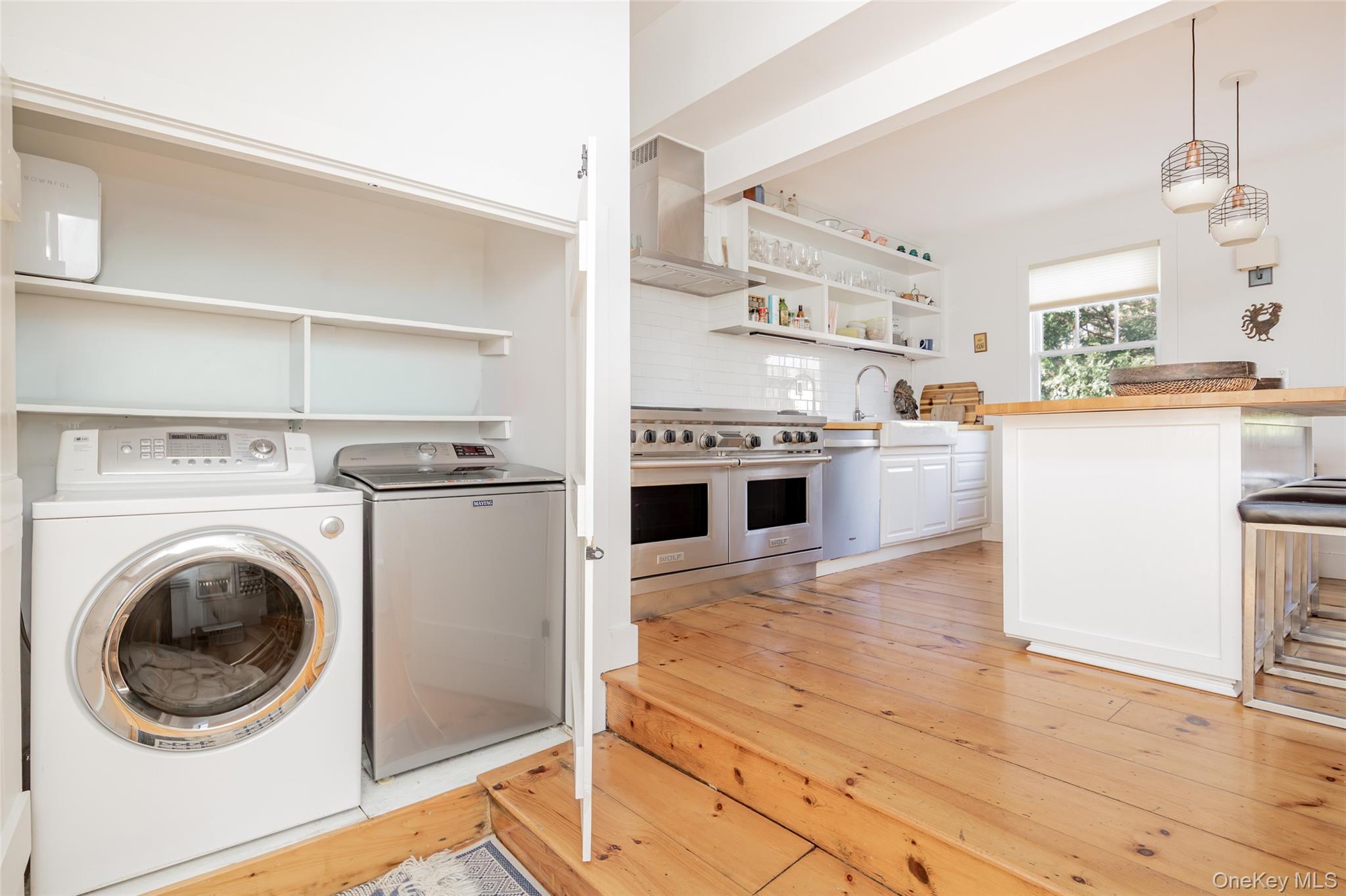 78 Mecox Road Water Mill, NY 11976 - Photo 11 of 41 a kitchen with a stove top oven sink and a refrigerator