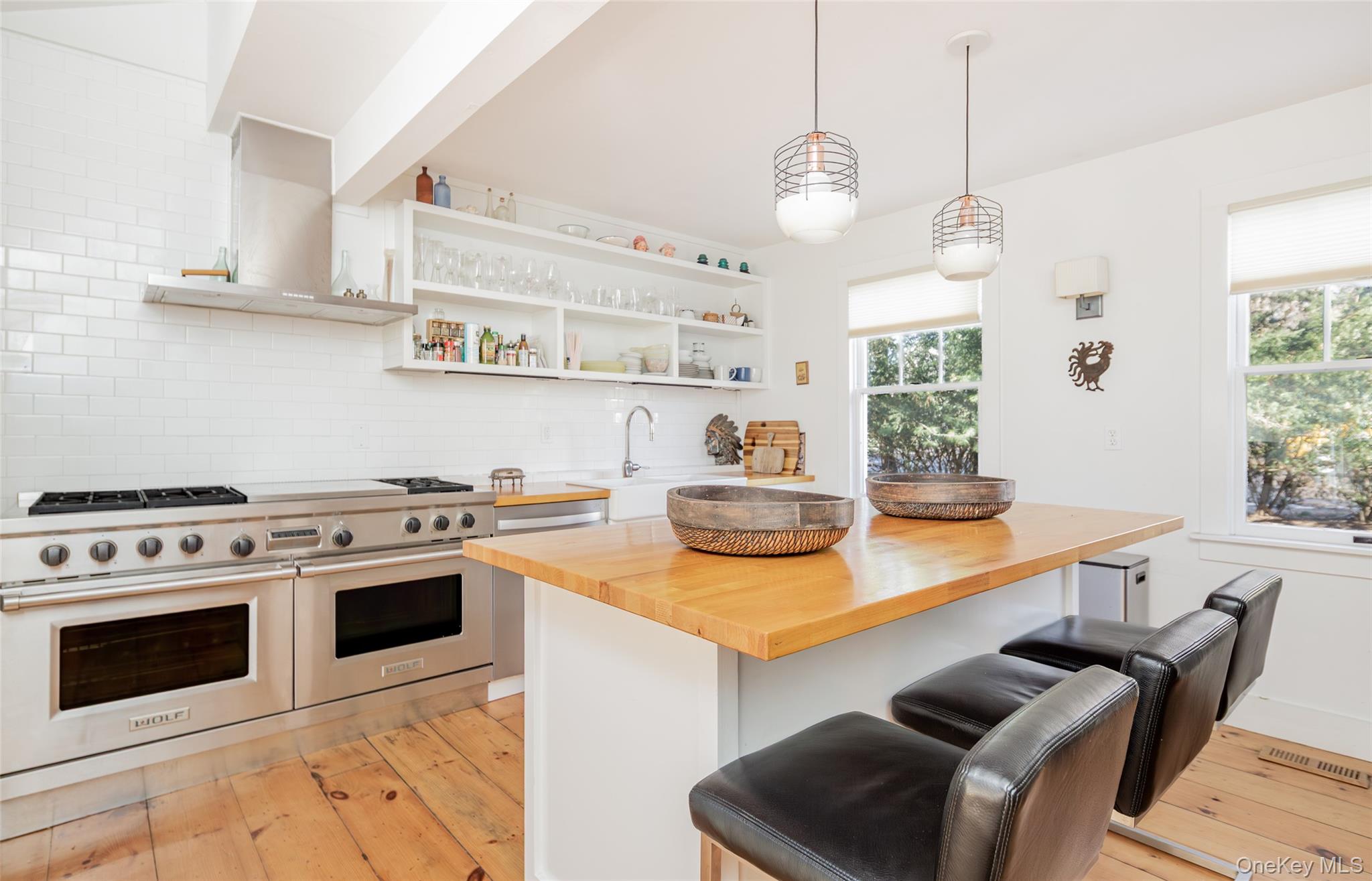 78 Mecox Road Water Mill, NY 11976 - Photo 12 of 41 a kitchen with stainless steel appliances a stove a sink and a refrigerator