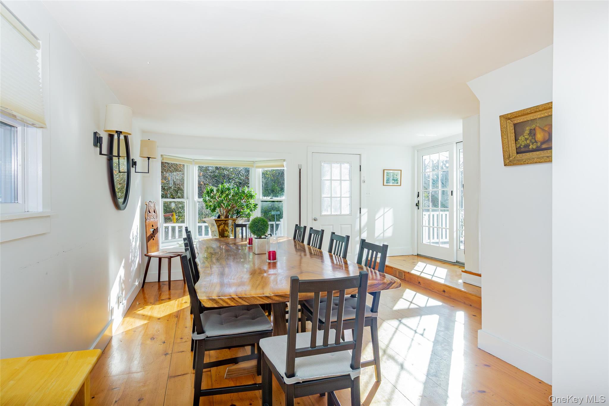 78 Mecox Road Water Mill, NY 11976 - Photo 14 of 41 a view of a dining room with furniture and a potted plant