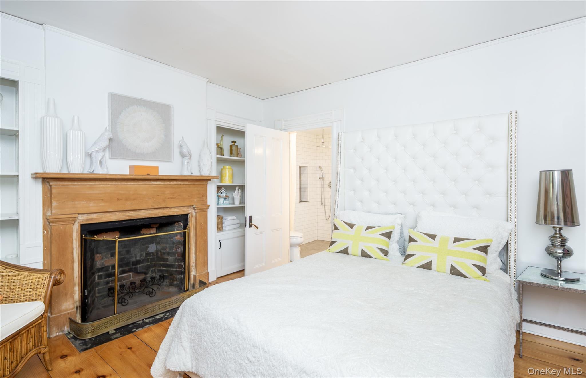 78 Mecox Road Water Mill, NY 11976 - Photo 22 of 41 a bedroom with a bed and a fireplace