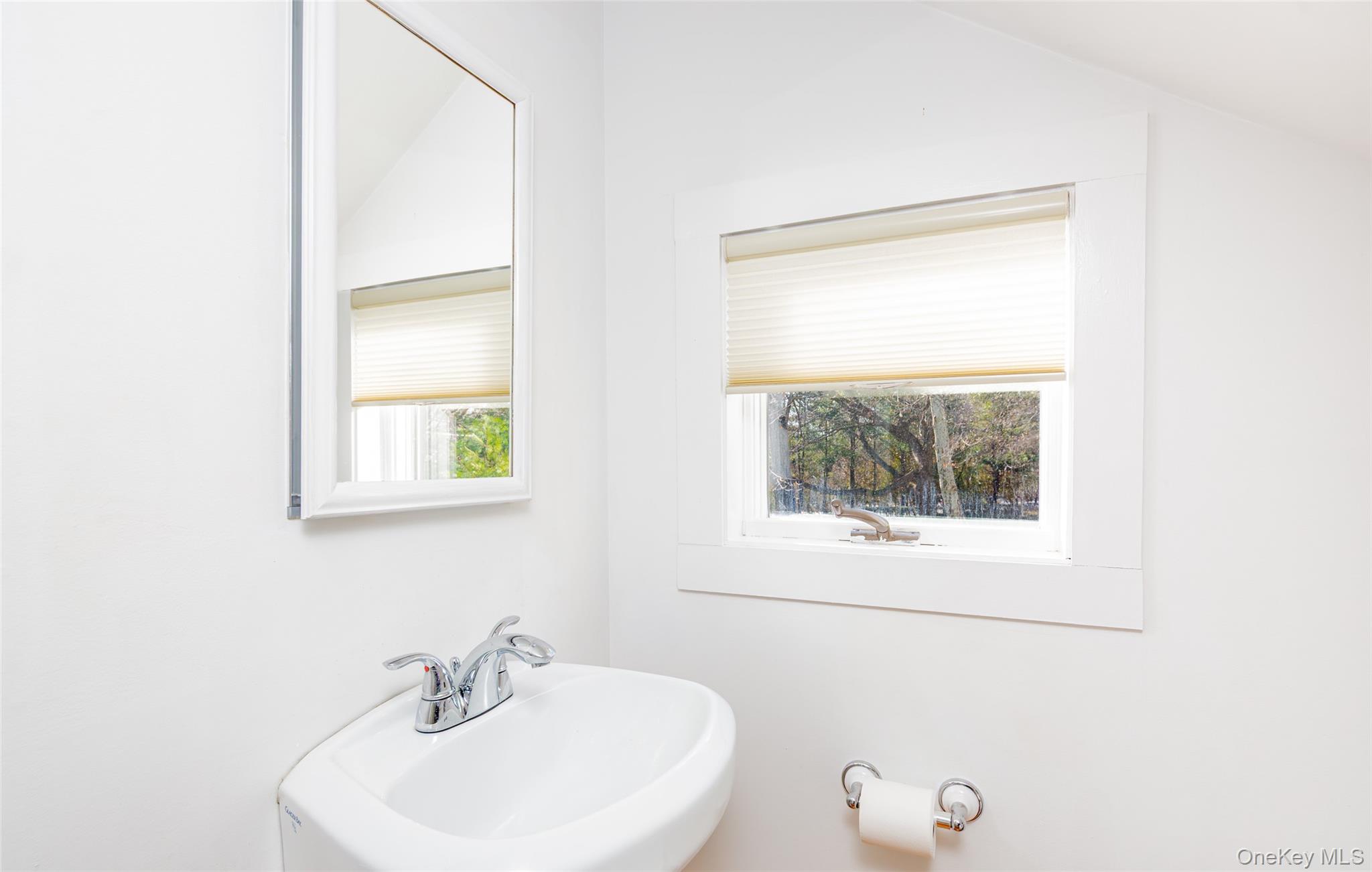78 Mecox Road Water Mill, NY 11976 - Photo 27 of 41 a bathroom with a sink a window and a mirror