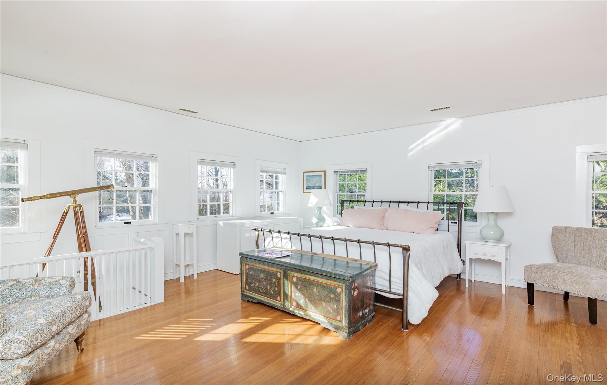 78 Mecox Road Water Mill, NY 11976 - Photo 28 of 41 a bed room with furniture and a wooden floor