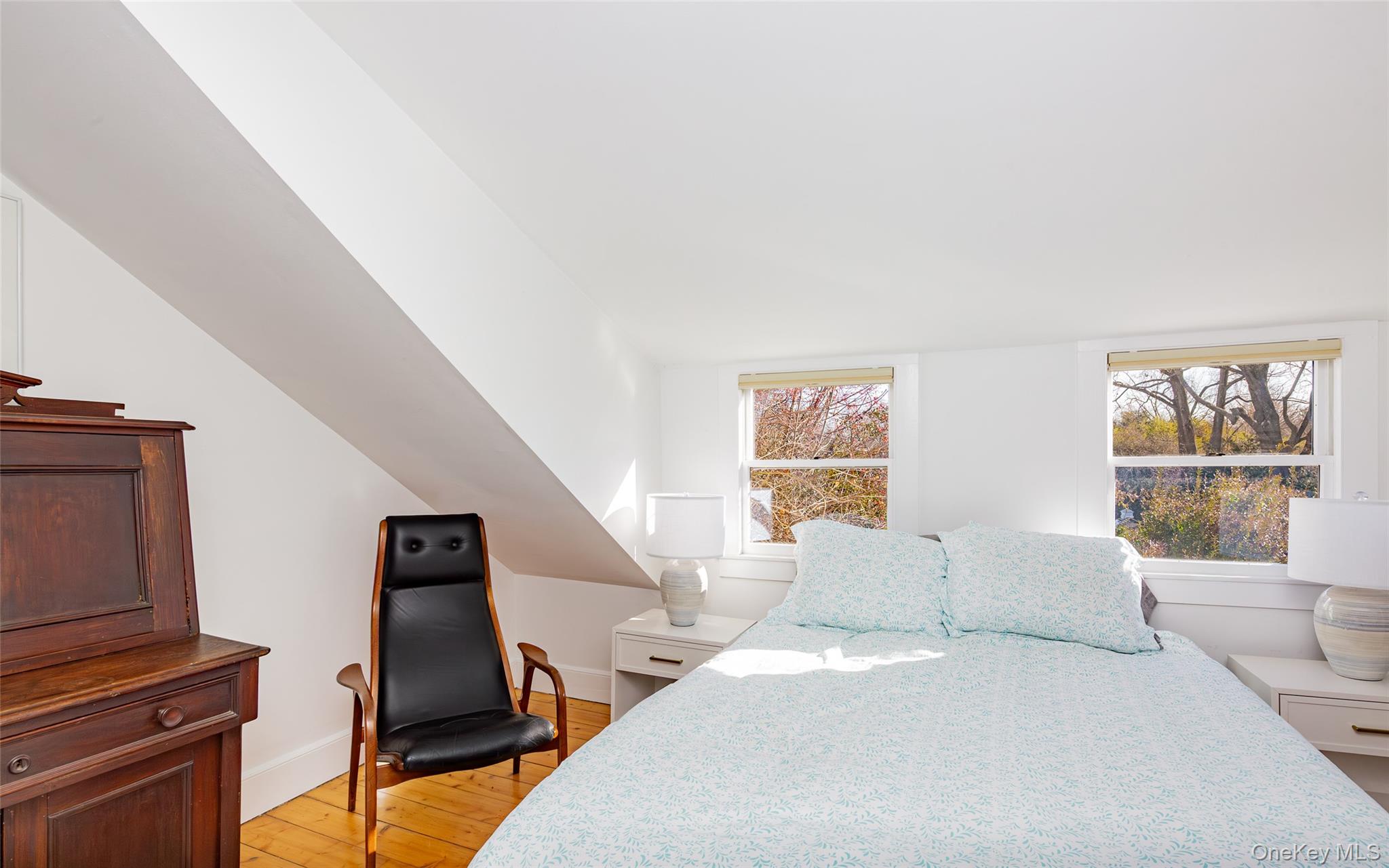 78 Mecox Road Water Mill, NY 11976 - Photo 35 of 41 a bedroom with a bed and wooden floor