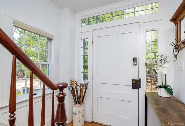 a view of an entryway with wooden floor