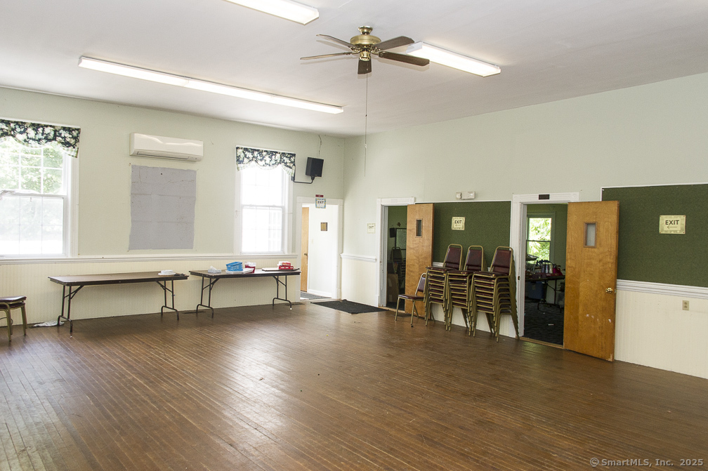 685 Kent Road New Milford, CT 06755 - Photo 12 of 34 a view of an empty room with window and wooden floor