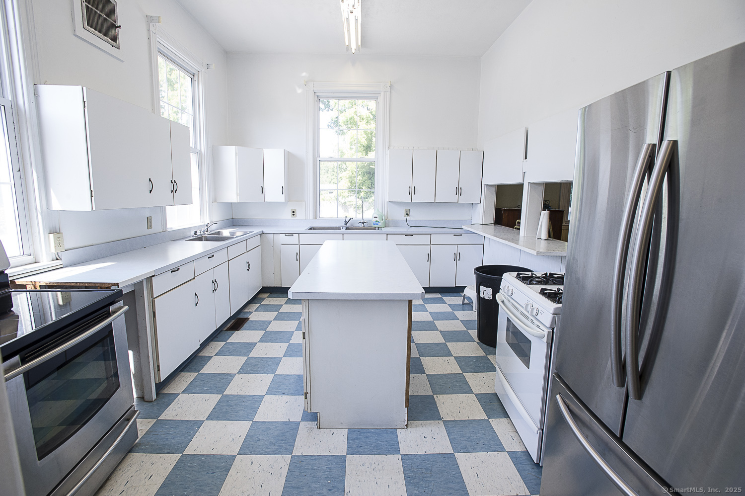 685 Kent Road New Milford, CT 06755 - Photo 15 of 34 a kitchen with stainless steel appliances a sink a stove a microwave and a refrigerator