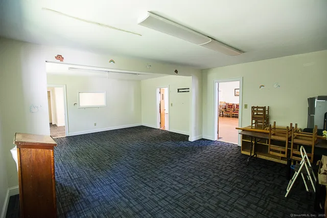 a view of an empty room with a closet