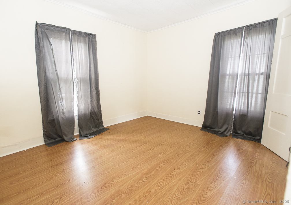 685 Kent Road New Milford, CT 06755 - Photo 30 of 34 an empty room with wooden floor and windows