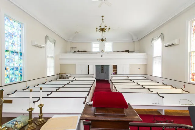 a bed room with a bed and a chandelier