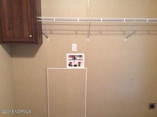 248 Peter Grant Road Snow Hill, NC 28580 - Photo 20 of 26 Utility Room view 3 - Washer & Dryer Hookups with Overhead Cabinets & Hanging Area