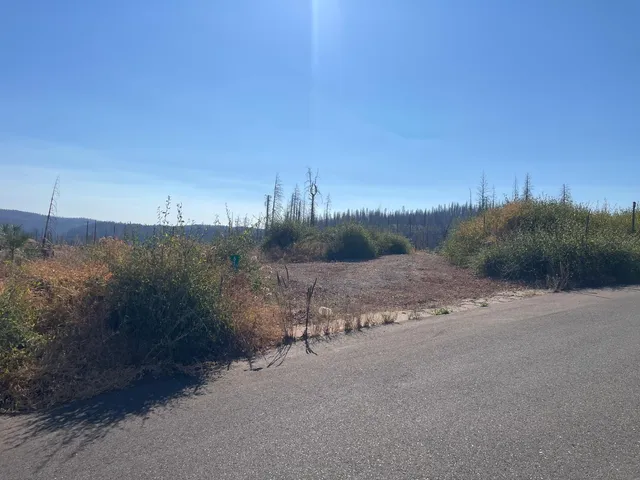 a view of a road with a building in background