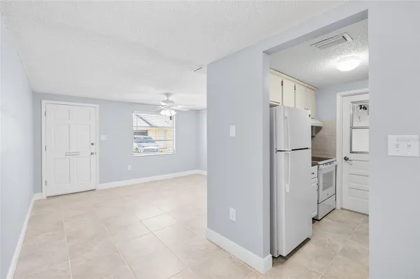 a kitchen with granite countertop a sink stainless steel appliances and cabinets