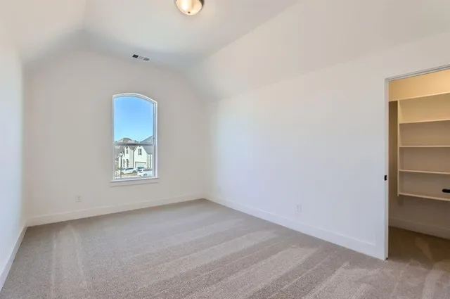 a view of an empty room and window