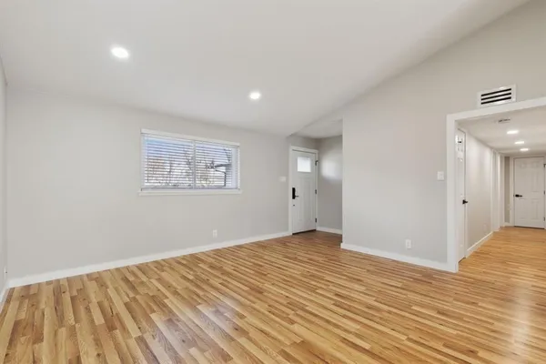 a view of an empty room and window