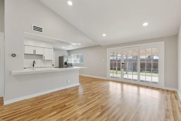 a view of kitchen with wooden floor and outdoor space