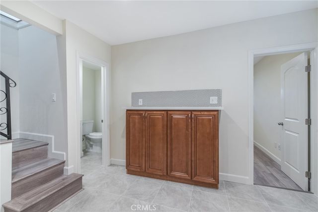 a spacious bathroom with a toilet and a sink