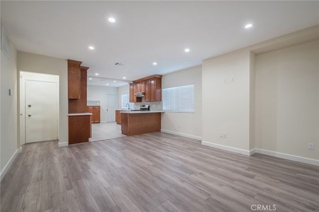 a view of kitchen with wooden floor