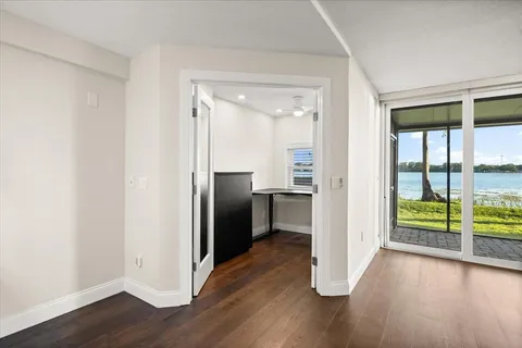 a kitchen with a refrigerator and a window