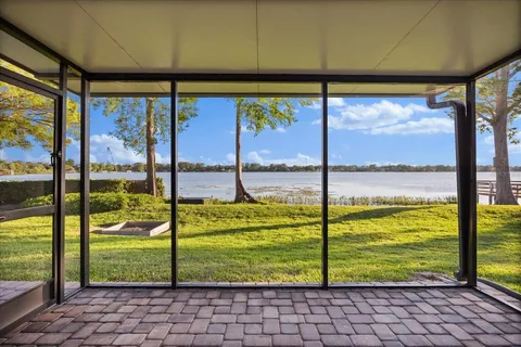 a view of kitchen and hallway with wooden floor