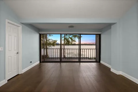 a bathroom with a tub a sink double vanity and a mirror