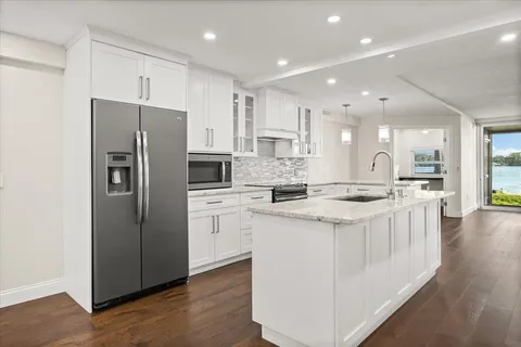 a large kitchen with a stove top oven