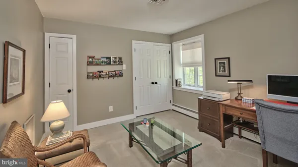 a workspace with furniture and window