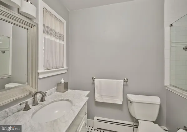 a bathroom with a sink toilet and vanity