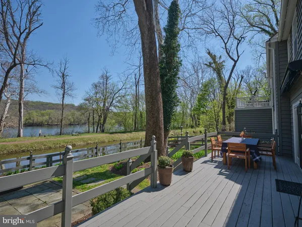 a view of deck with table and chairs and wooden floor