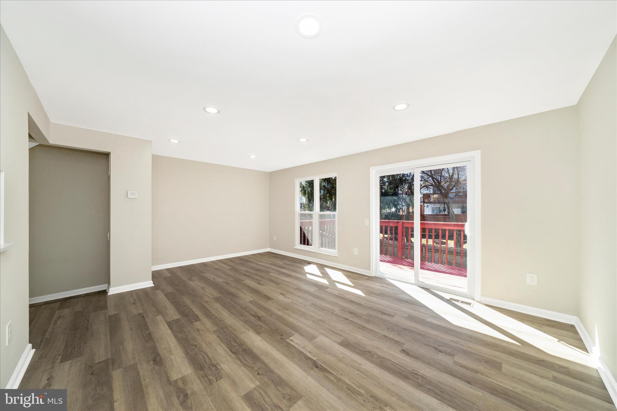 1848 Murdock Court Frederick, MD 21702 - Photo 12 of 54 a view of an empty room with wooden floor and a window