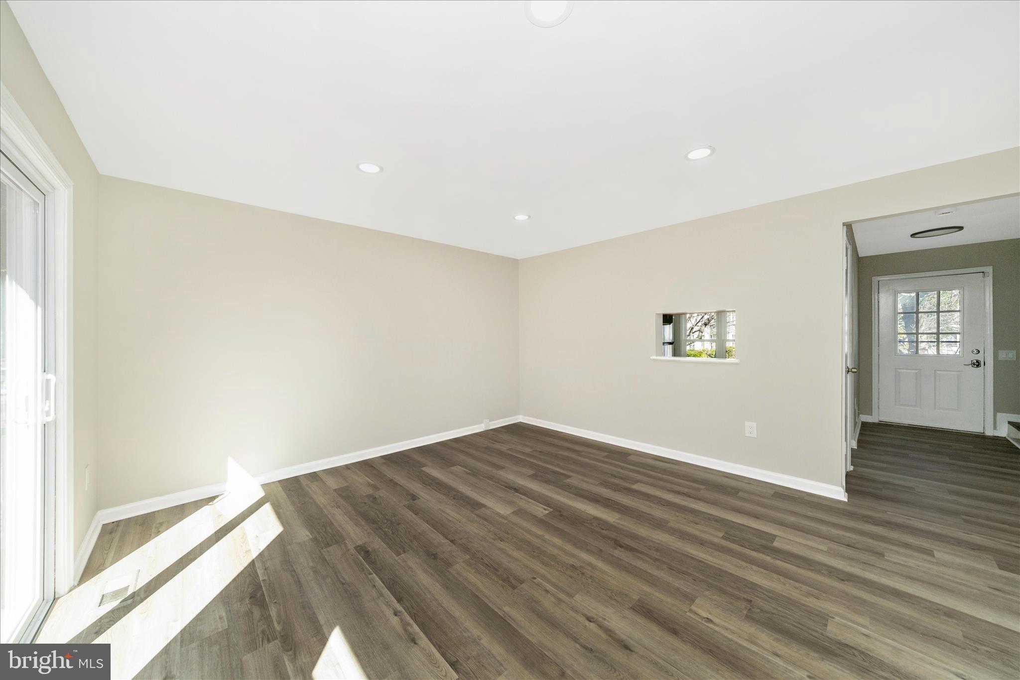 1848 Murdock Court Frederick, MD 21702 - Photo 14 of 54 an empty room with wooden floor and windows