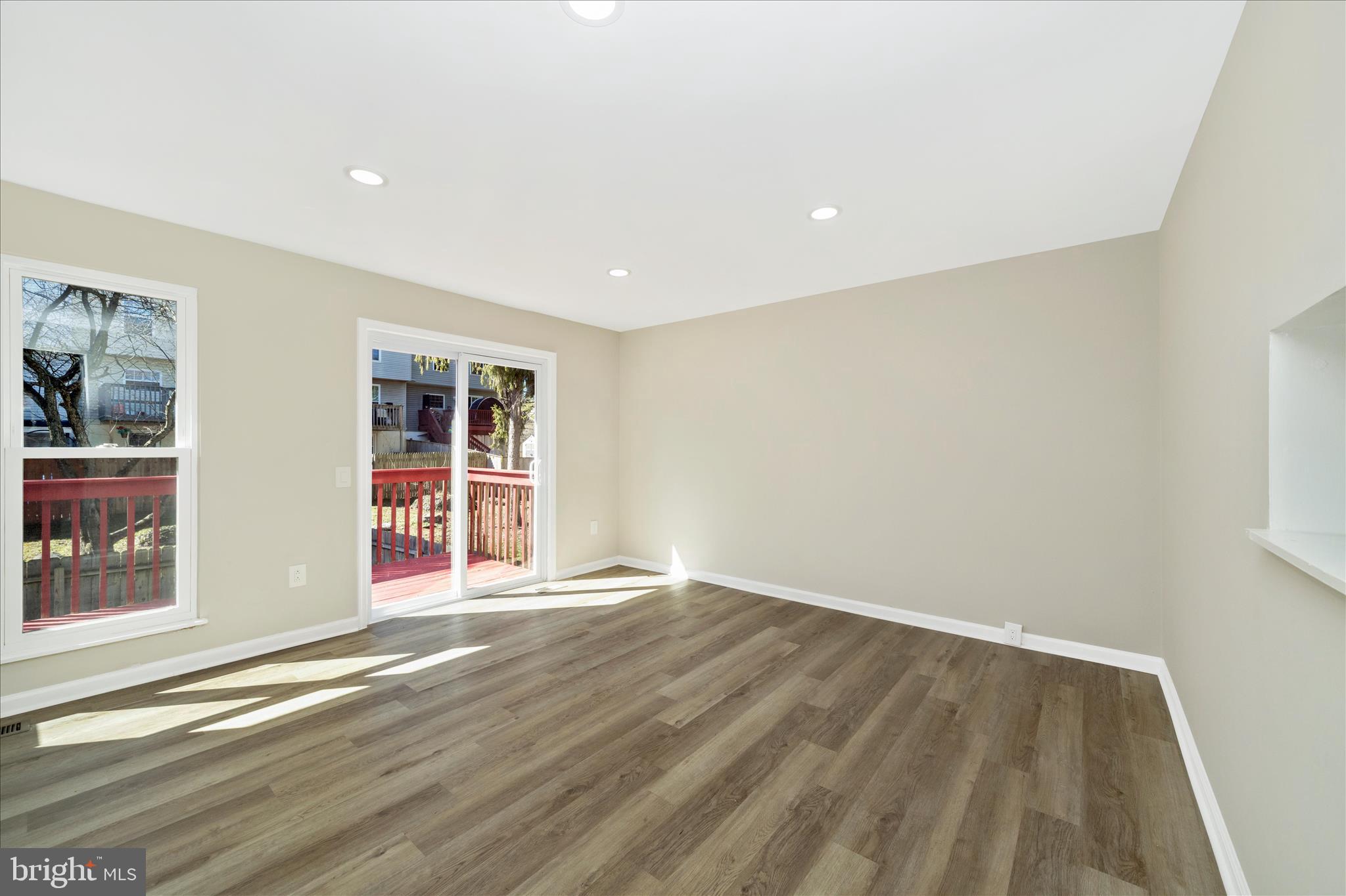 1848 Murdock Court Frederick, MD 21702 - Photo 15 of 54 a view of an empty room with wooden floor and a window