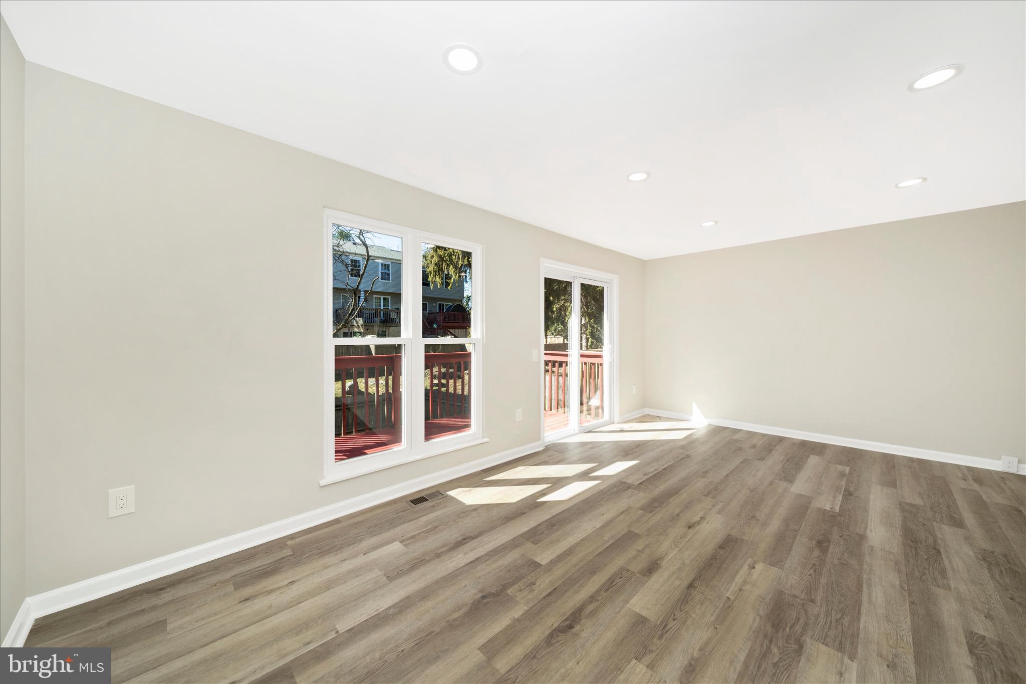 1848 Murdock Court Frederick, MD 21702 - Photo 19 of 54 an empty room with wooden floor and windows