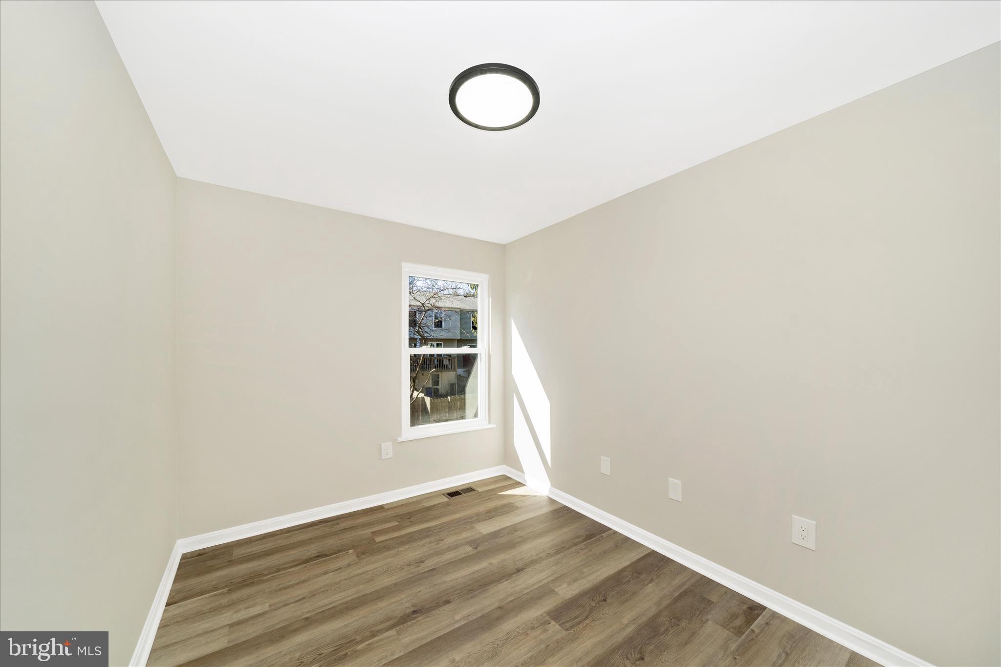 1848 Murdock Court Frederick, MD 21702 - Photo 25 of 54 a view of a room with wooden floor and window