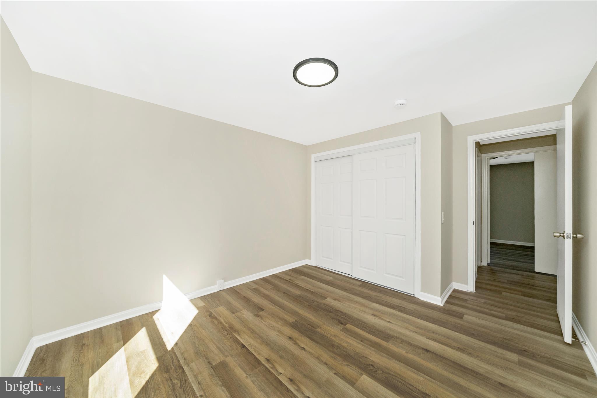 1848 Murdock Court Frederick, MD 21702 - Photo 28 of 54 a view of a room with wooden floor and white walls