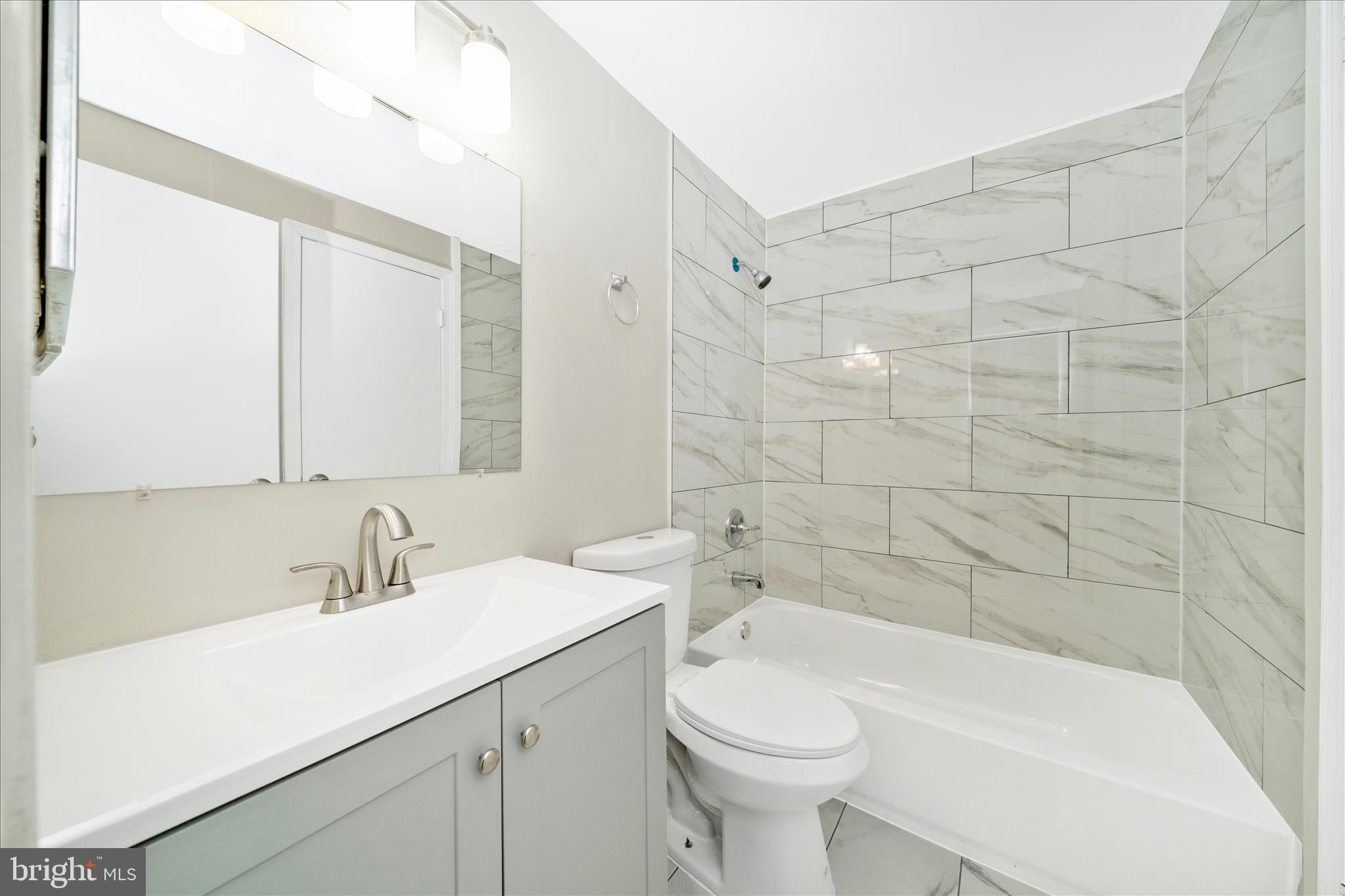 1848 Murdock Court Frederick, MD 21702 - Photo 30 of 54 a bathroom with a sink mirror toilet and bathtub