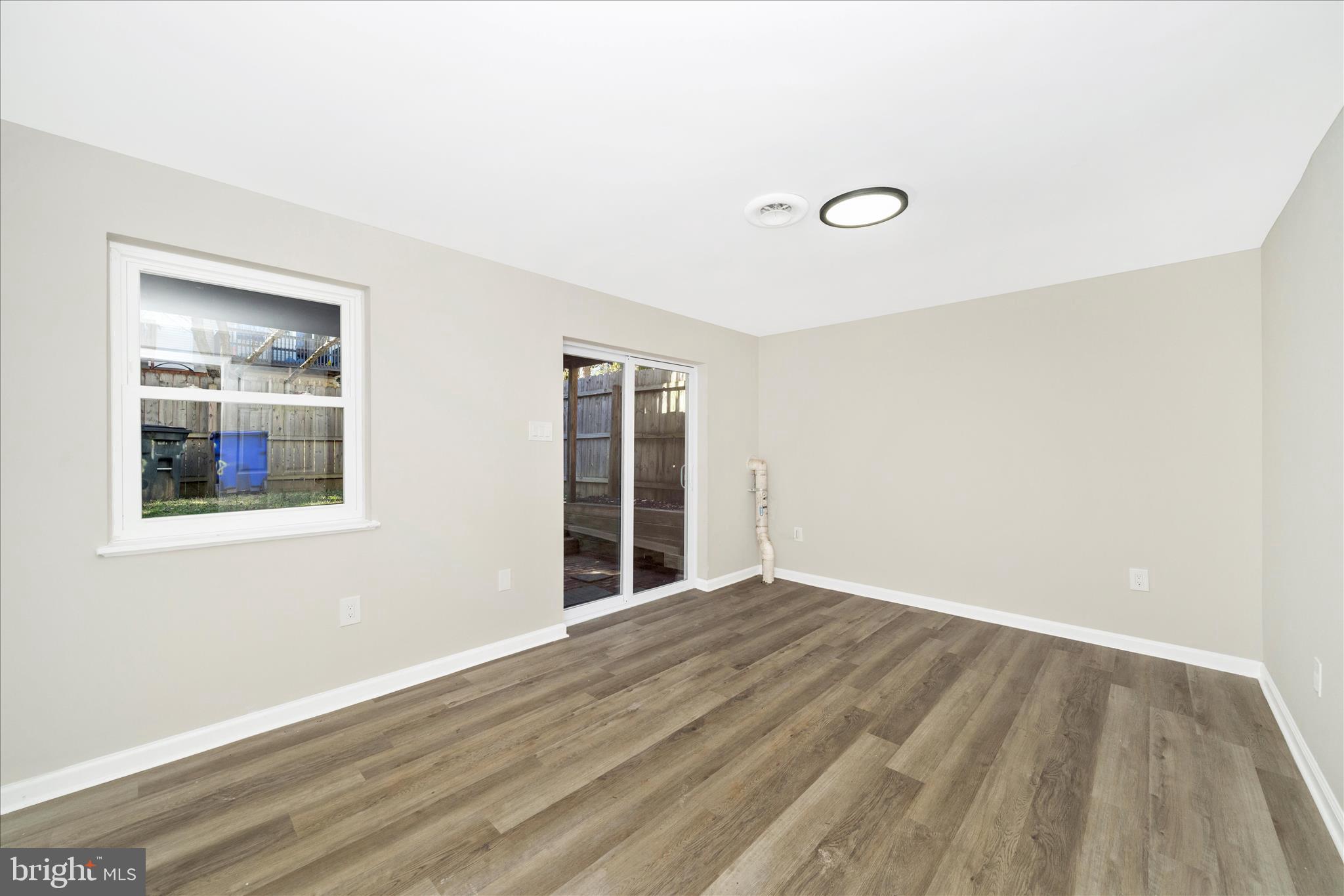 1848 Murdock Court Frederick, MD 21702 - Photo 34 of 54 an empty room with wooden floor and windows