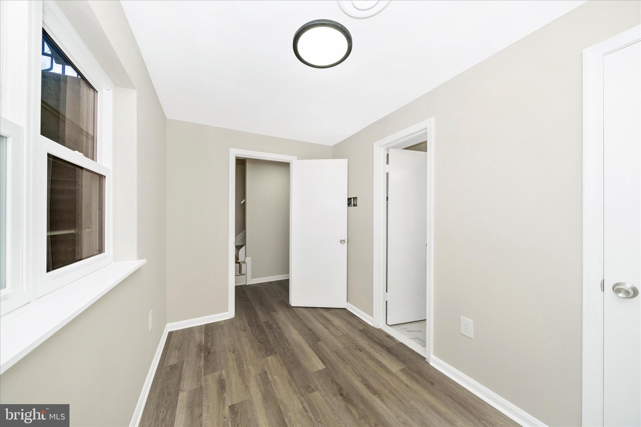 1848 Murdock Court Frederick, MD 21702 - Photo 37 of 54 a view of empty room with wooden floor
