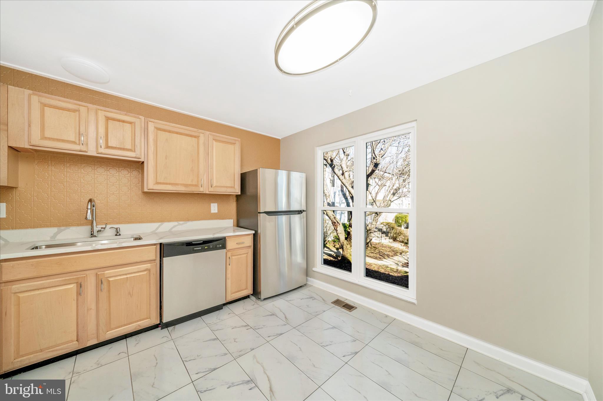 1848 Murdock Court Frederick, MD 21702 - Photo 6 of 54 a kitchen with stainless steel appliances granite countertop a refrigerator and a sink