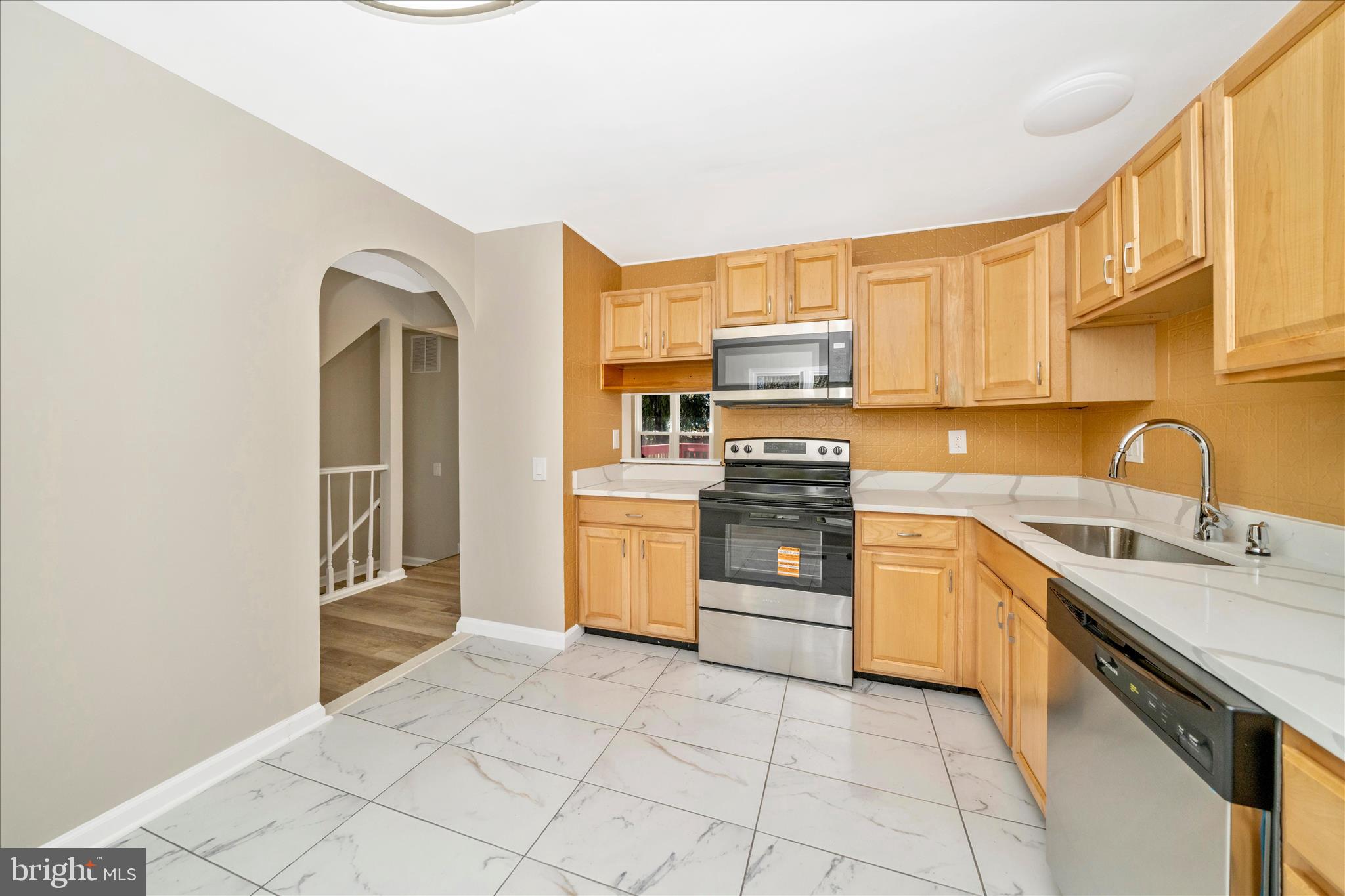 1848 Murdock Court Frederick, MD 21702 - Photo 8 of 54 a kitchen with stainless steel appliances granite countertop a stove sink and cabinets