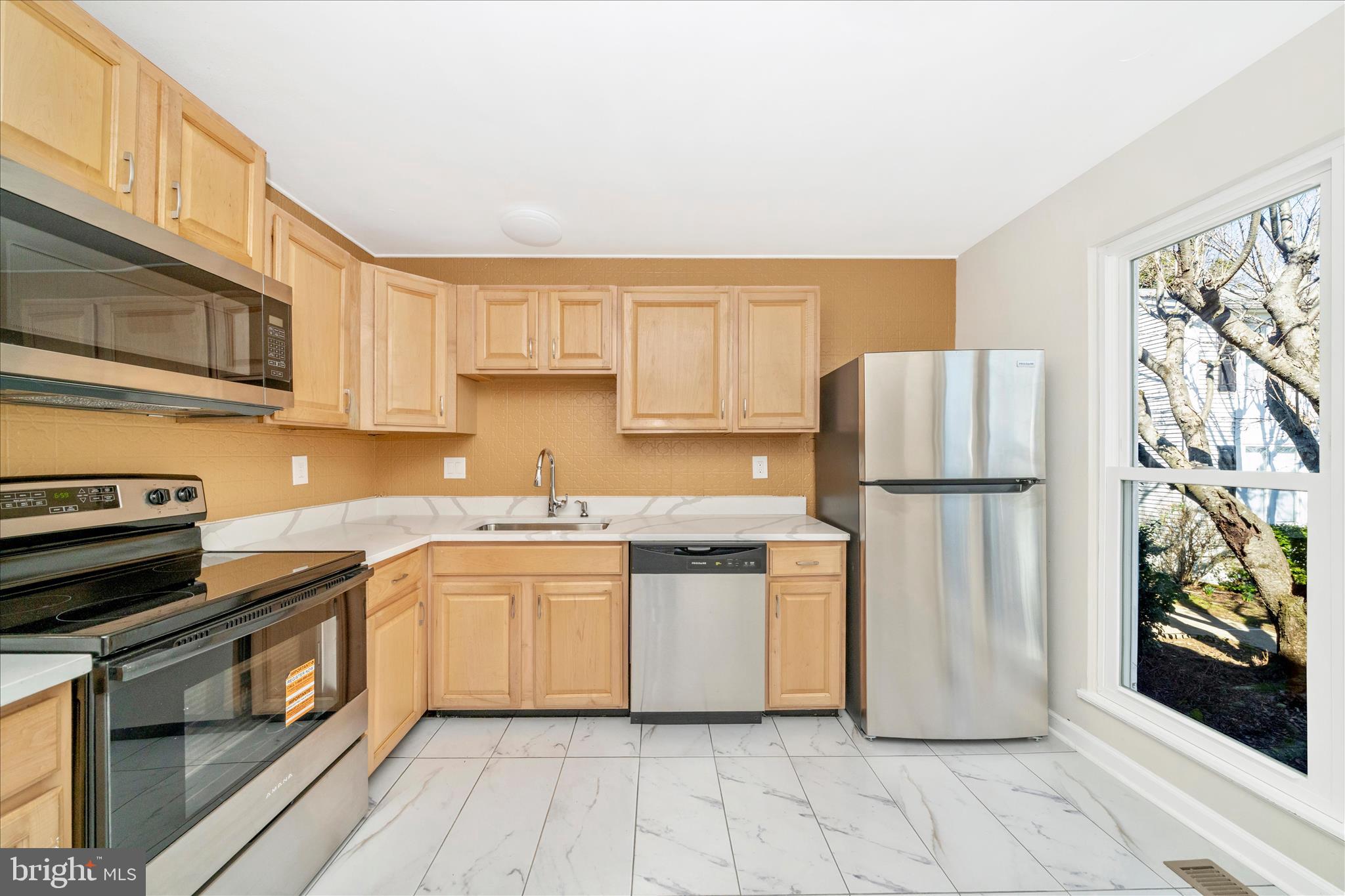 1848 Murdock Court Frederick, MD 21702 - Photo 10 of 54 a kitchen with a sink a refrigerator and cabinets
