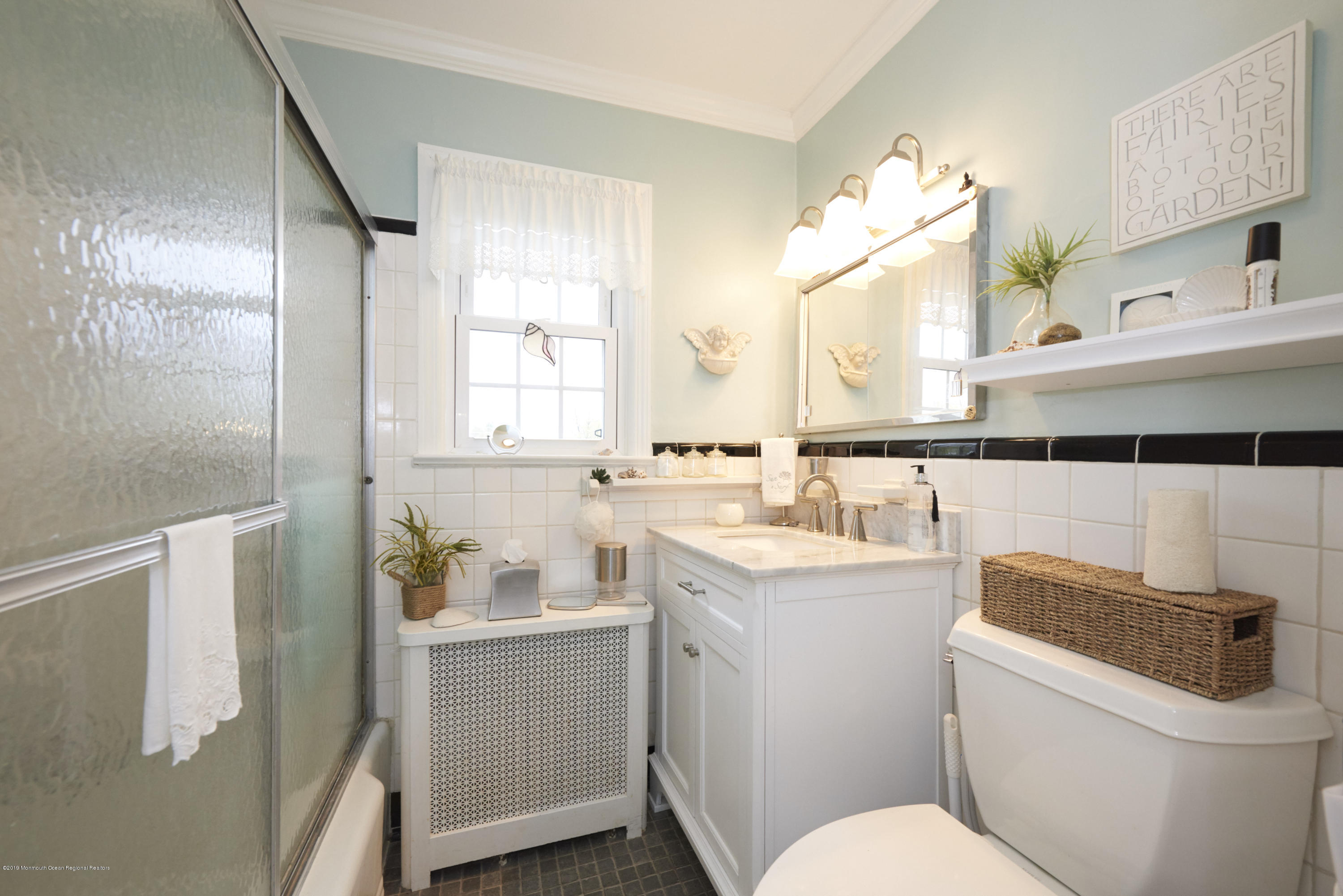 30 Pinckney Road, Unit C Red Bank, NJ 07701 - Photo 11 of 18 a bathroom with a sink a toilet and vanity